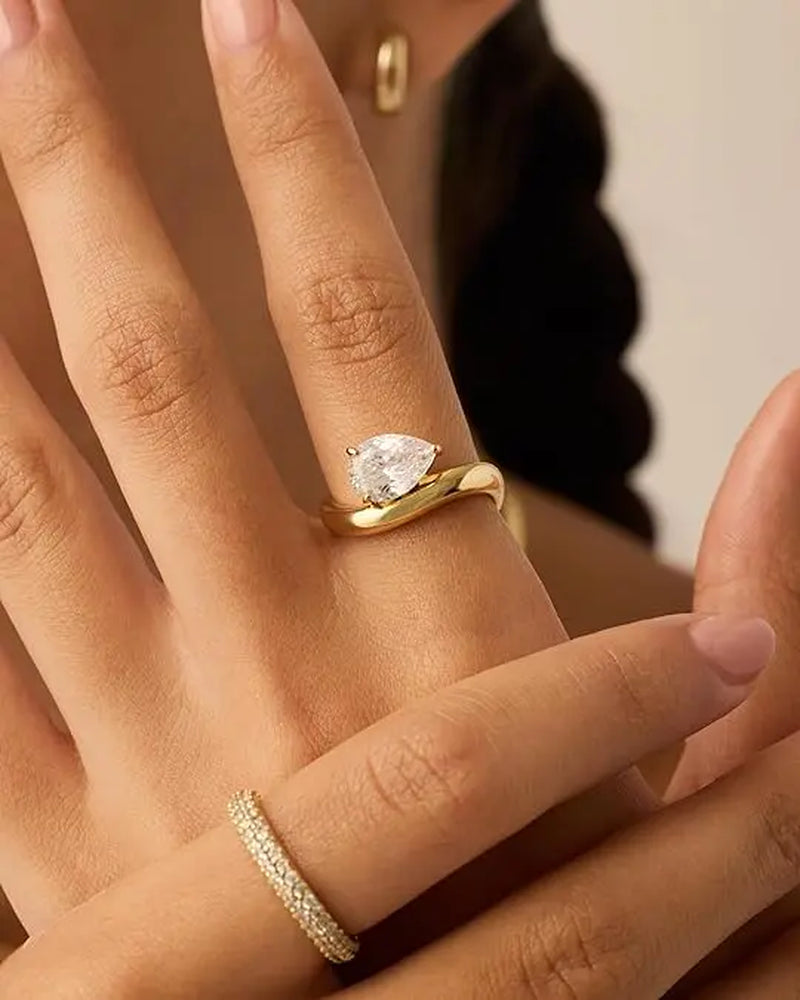 PAVOI 14K Gold Plated Pear Solitaire Premium Cubic Zirconia Engagement Ring for Women | Elegant Faux Wedding Ring | Wavy Band Promise Ring