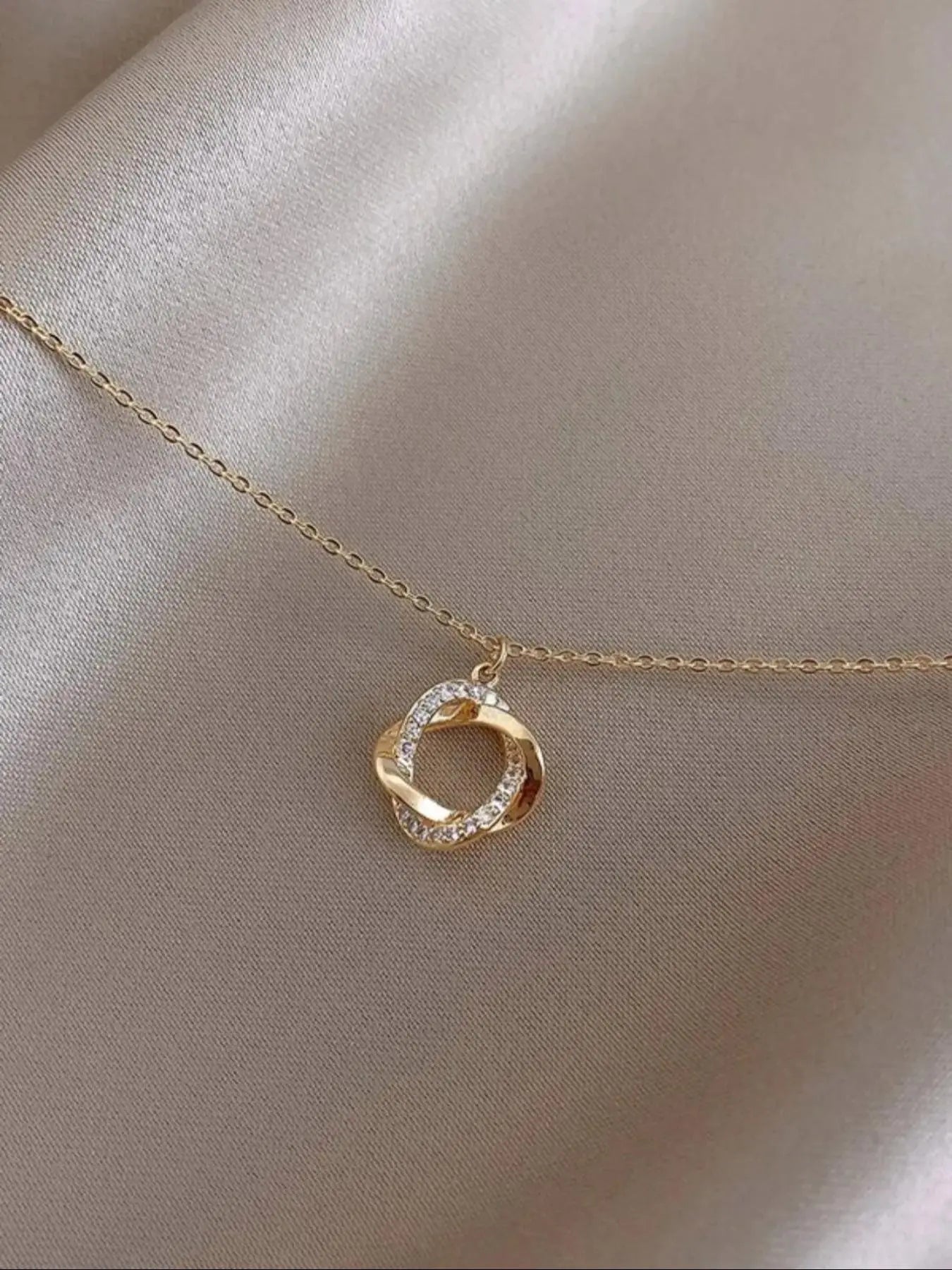 Twisted Circle Pendant Necklace with Rhinestone Accents
